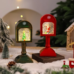 Detail of red vintage Christmas mailbox light with Santa Claus and sparkling glitter inside