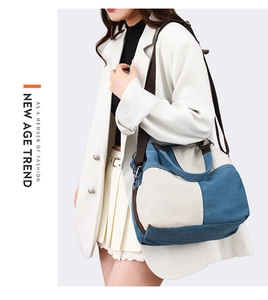 Detail of blue and beige patchwork canvas tote bag with brown straps for daily commute