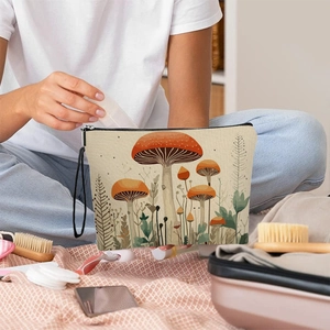 Canvas makeup bag featuring vintage forest mushroom prints and convenient carry strap
