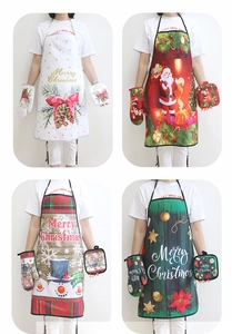 Detail view of four Christmas kitchen sets including aprons, oven mitts and heat pads