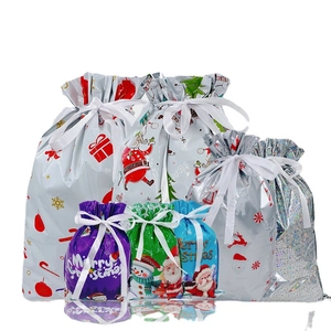 Christmas drawstring gift bags set with festive prints and ribbons in various sizes