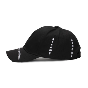 Black cotton baseball cap with white embroidery featuring Always a good listener side view