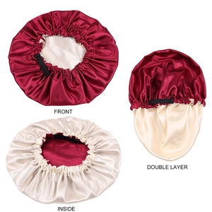 Detail of double-layer satin bonnet showing wine red and beige sides with elastic band