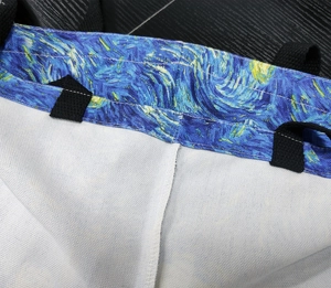 Detailed close-up of Van Gogh Starry Night canvas tote bag with reinforced black handle