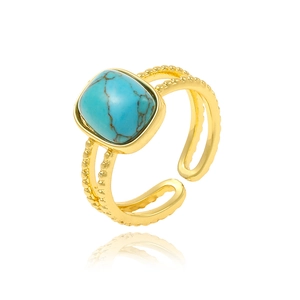 Detail of adjustable gold ring with square turquoise stone and beaded texture