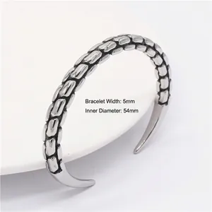 Detail view of 5mm wide vintage steel cuff bracelet with textured scale pattern