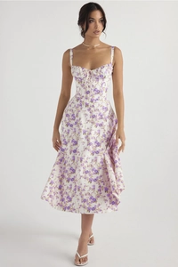 Close-up of white floral sundress with purple flower print and drawstring neckline