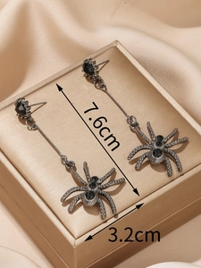 Edgy gunmetal spider earrings with black gemstones and dimensional drop design