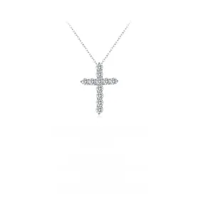 Macro detail of Moissanite cross pendant with pavé-set gems on a fine silver chain