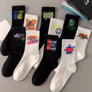 Detail of cotton crew socks with graffiti prints like skull and letter patterns