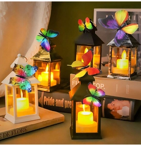 Close-up of colorful 3D PVC butterfly stickers on vintage lanterns with LED candles