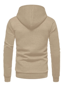 Close-up of camel waffle textured fabric on the back of a men's long sleeve hoodie