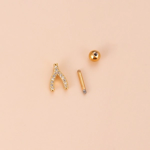Gold stainless steel wishbone stud earring with sparkling zircon in a disassembled view