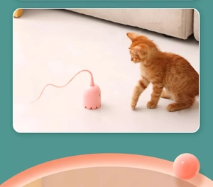 Pink smart octopus cat toy with rotating tail interacting with a kitten in a home setting