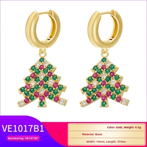 Detail of Christmas tree earrings with colorful rhinestones in gold brass finish
