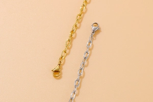 Detailed view of hammered texture gold and silver thick chain links with lobster clasps