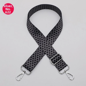 Detail of adjustable woven shoulder strap with black and white geometric triangle patterns