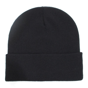 Detail of classic black knitted beanie showing soft ribbed texture and wide folded cuff