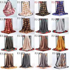 Collage of 16 different printed satin square scarves with various classic patterns and colors