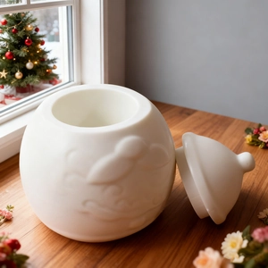 White ceramic Santa storage jar with embossed texture and lid for Christmas decor