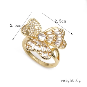 Detail view of 2.5cm gold butterfly ring with pave set cubic zirconia stones