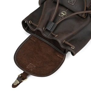 Detail of crazy horse leather backpack showing drawstring closure and bronze hardware