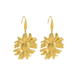 Detailed macro view of gold-tone sunflower drop earrings with hammered metal texture