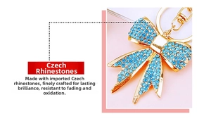 Macro view of blue crystal rhinestone bow keychain with polished gold-tone alloy metal