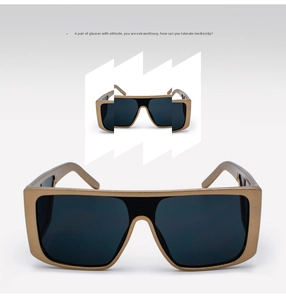 Close-up of retro oversized one-piece mirrored sunglasses with matte bronze metallic frames