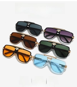 Close-up of six colorful pilot sunglasses with double-bridge frames and metal hinges