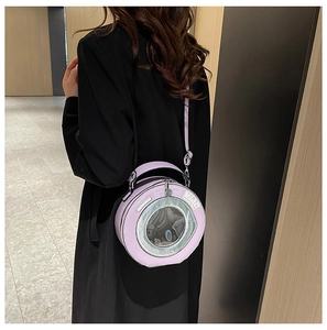 Detail view of lavender washing machine shaped bag with silver ring and shoulder strap