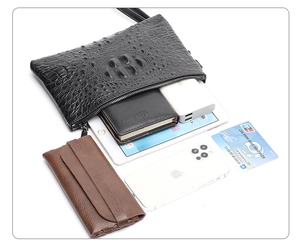 Top view of crocodile pattern leather clutch bag showing large capacity for tablet and phone