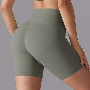 Close-up of high-waisted seamless fitness shorts in morandi green with ergonomic stitching