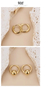 Detail of minimalist 18K gold plated stainless steel hoops and ball drop earrings