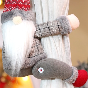 Christmas gnome curtain tieback with red striped hat and white beard on home curtains