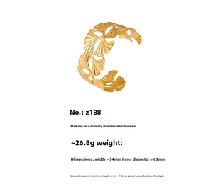 Detailed view of wide 34mm stainless steel ginkgo leaf cuff bracelet with golden finish