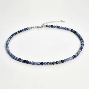 Close-up of 4mm blue and white natural stone beads necklace with silver lobster clasp