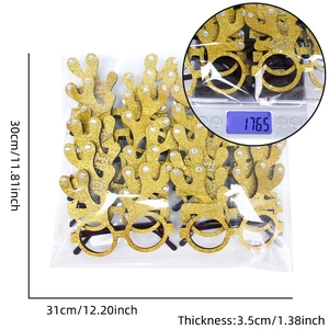 Detailed view of Christmas reindeer antler glasses with gold glitter and pearls in packaging