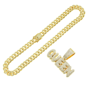 Iced out gold Queen letter pendant with sparkling crystals on classic Cuban link chain