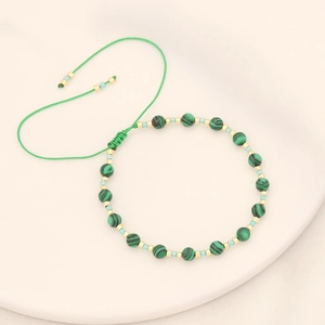 Bohemian woven bead bracelet with malachite green stones and adjustable green cord