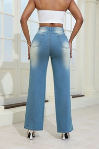 Back view of high-waisted light blue wide-leg jeans with symmetrical patch pockets