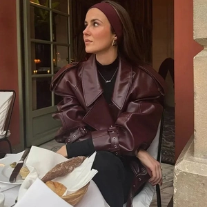 Vintage burgundy leather jacket with lapel collar and relaxed fit for chic outdoor styling