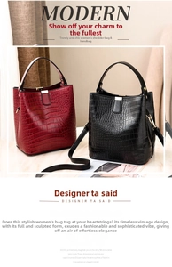 Detail showing red and black crocodile pattern bucket bags with gold hardware