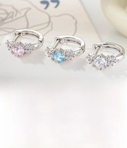 Detailed view of silver hoop earrings with 9mm inner diameter and colorful zircon stones