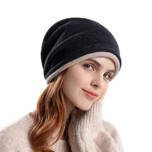 Winter knit slouchy beanie for women featuring a minimalist black and beige color block design