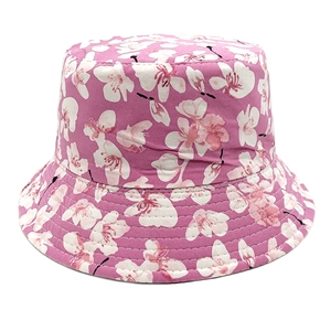 Women's reversible sun bucket hat with pink cherry blossom floral print for summer