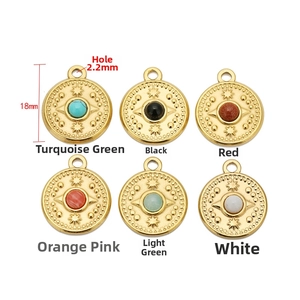 Detail of 18mm bohemian compass pendants with colorful stones and 18K gold plating