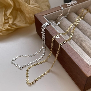 Minimalist S925 sterling silver chain necklaces in gold and silver finish on a jewelry box