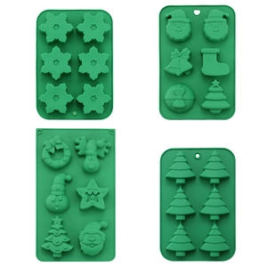 Set of four green silicone molds for Christmas cookies and candy with various shapes