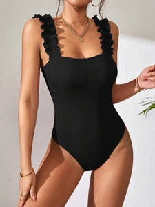 Women black ribbed knit bodysuit with ruffle shoulder straps on a clean white background